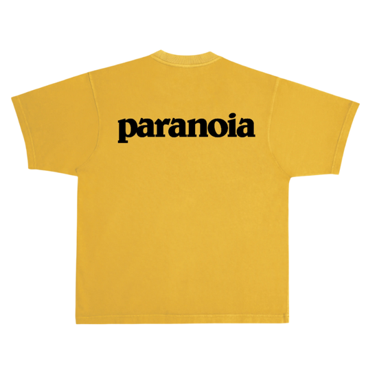 Yellow t-shirt with 'paranoia' text on a white background